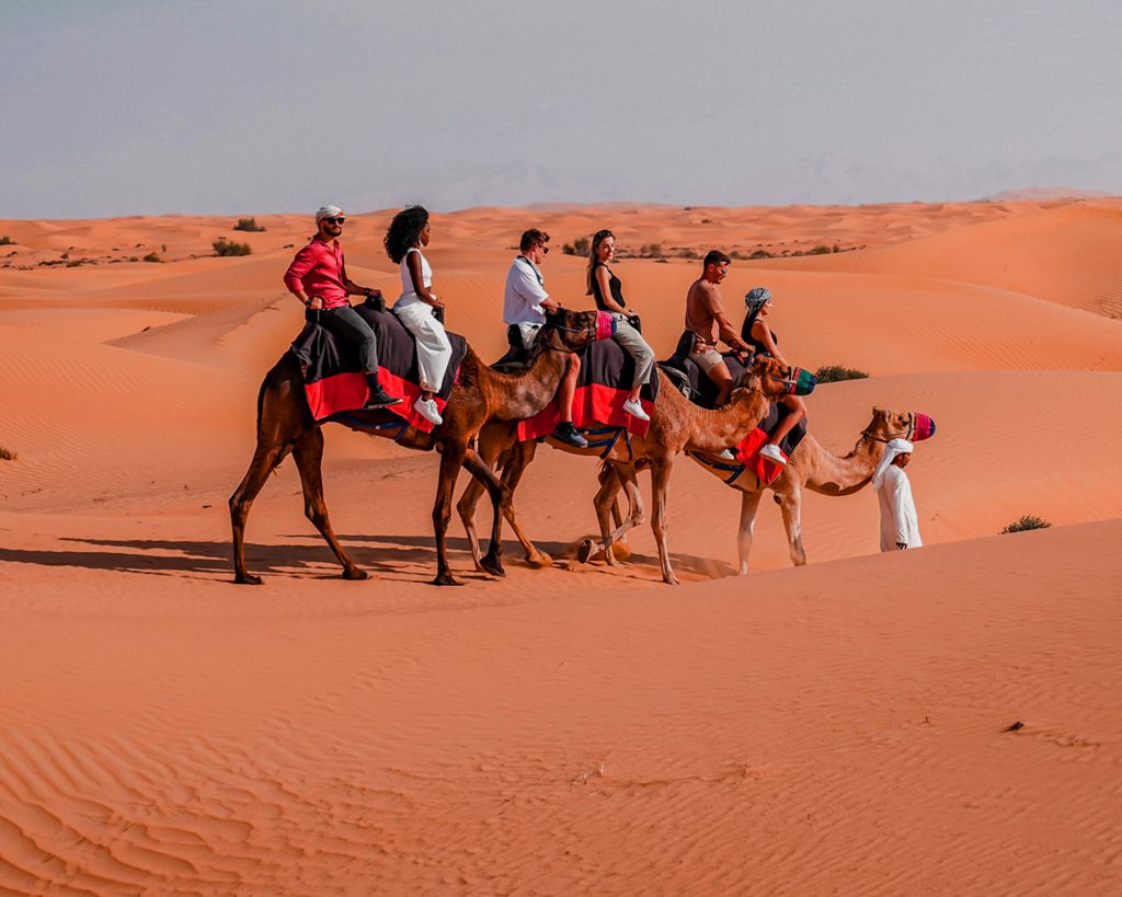 camel riding in desert safari package